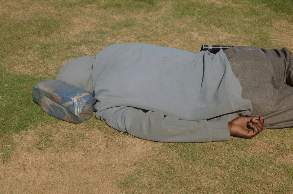 Man asleep on the Golden Mile, Durban, South Africa. Photo by Michelle Sank